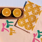 Ochre Ornaments on Blush Dinner Napkins