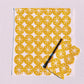 Ochre Ornaments on White Dinner Napkins