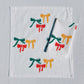 Holiday Bows on White Dinner Napkins