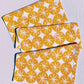 Ochre Ornaments on White Table Runner