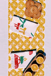 Ochre Ornaments on White Table Runner