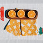Ochre Ornaments on White Dinner Napkins