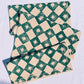 Green Diamond Spurs on Oatmeal Table Runner
