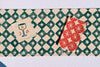 Green Diamond Spurs on Oatmeal Table Runner