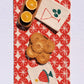 Red Ornaments on Oatmeal Table Runner