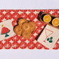 Red Ornaments on Oatmeal Table Runner