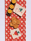 Red Ornaments on Oatmeal Table Runner