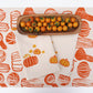 Orange Gourds on Oatmeal Runner