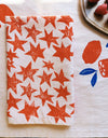 Orange Stars on Blush Dinner Napkins